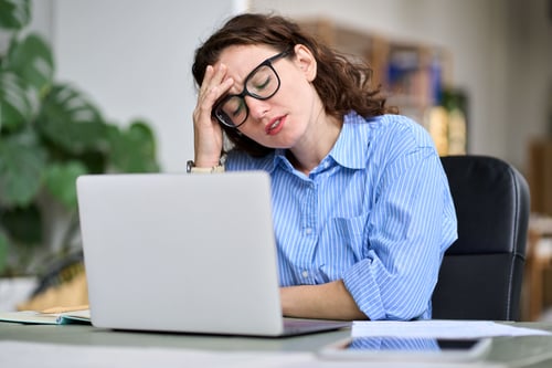 tired-young-business-woman-touching-head-feeling-h-2025-02-11-16-16-21-utc